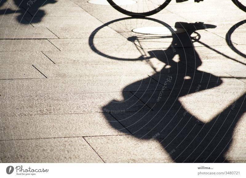 Shadow of a cyclist Cycling Leisure and hobbies Sports Human being Athletic recreational sport Bicycle Shadow play