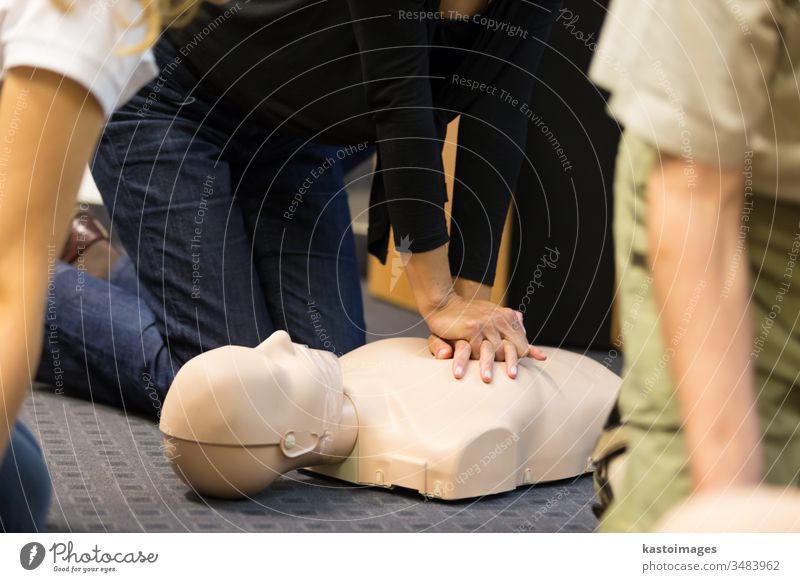 First aid CPR seminar. emergency training procedure first aid medical cpr paramedic medicine doctor life saving doll patient people dummy care instructor