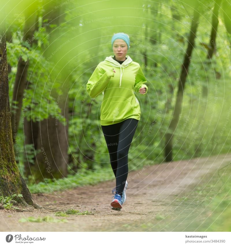 Sporty young female runner in the forest. active sport woman girl exercise fit activity person lifestyle sporty recreation workout athletic outside jogger