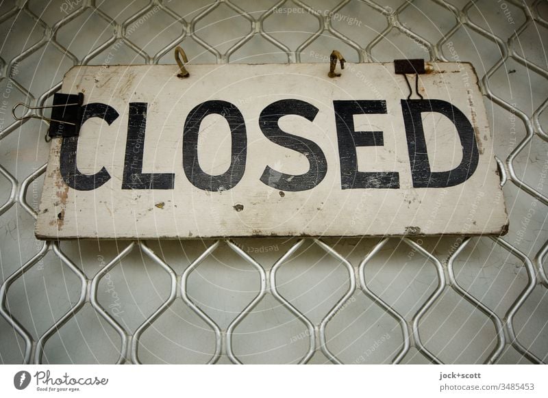Closed hangs on a closed deal English Typography Signage Signs and labeling Authentic upper-case letters Information Subdued colour Retro Design Abstract Firm