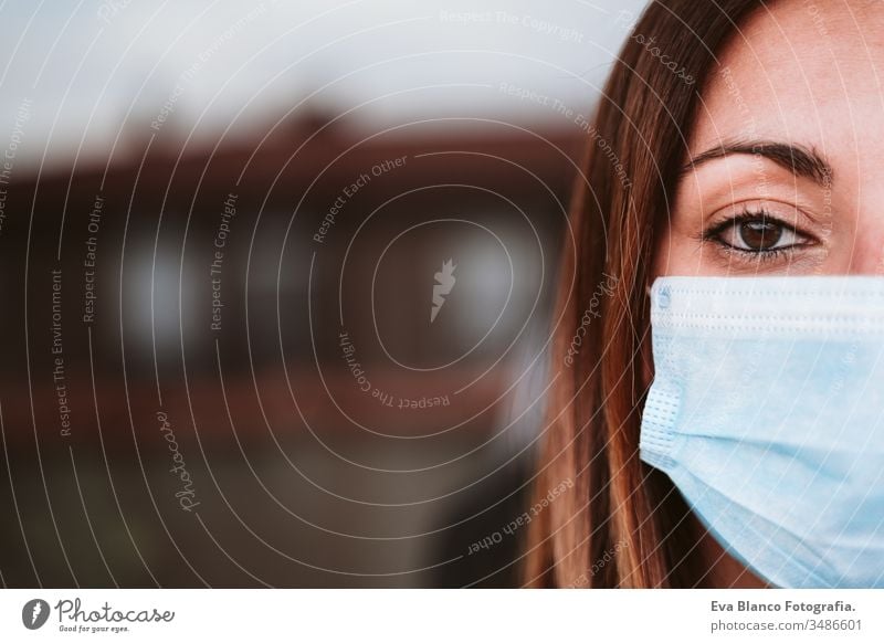 portrait of young woman at home wearing a protective mask. Coronavirus covid-19 concept safe coronavirus quarantine terrace ill infection patient sick medicals