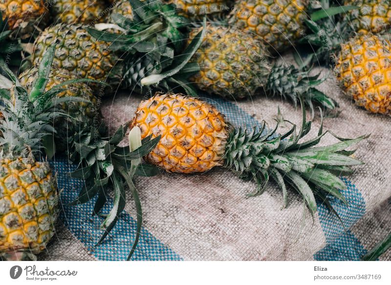 Several whole pineapples at one fruit stand Pineapple Asia Delicious Lie Fruit Nutrition Fresh Colour photo Fruit- or Vegetable stall Deserted Food