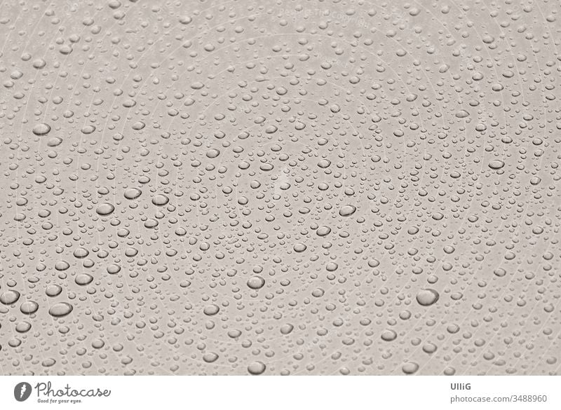 Raindrops on a painted metal sheet - Thick raindrops roll off a shiny painted metal sheet. Gnothimage adhere adhesion background beads beautiful black cohesion