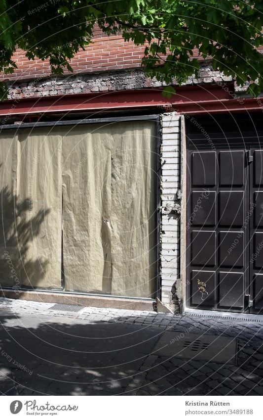 abandoned shop Closed too business Load Shop window Window masked pasted up Facade forsake sb./sth. Task give up bankrupt bankruptcy broke
