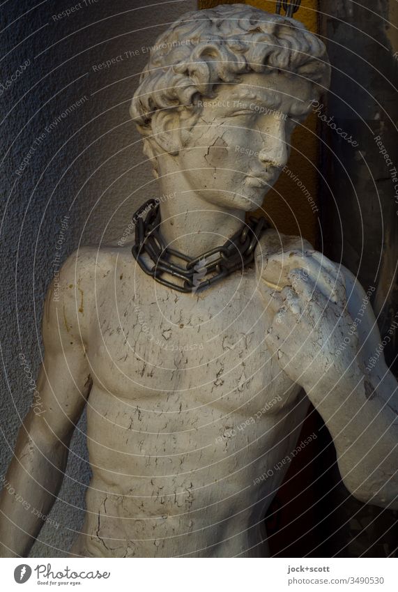 Ideal in chains beauty ideal Statue Ravages of time Weathered Upper body Backup Esthetic Young man Sculpture King David Paint is off idealism Chained up unhappy