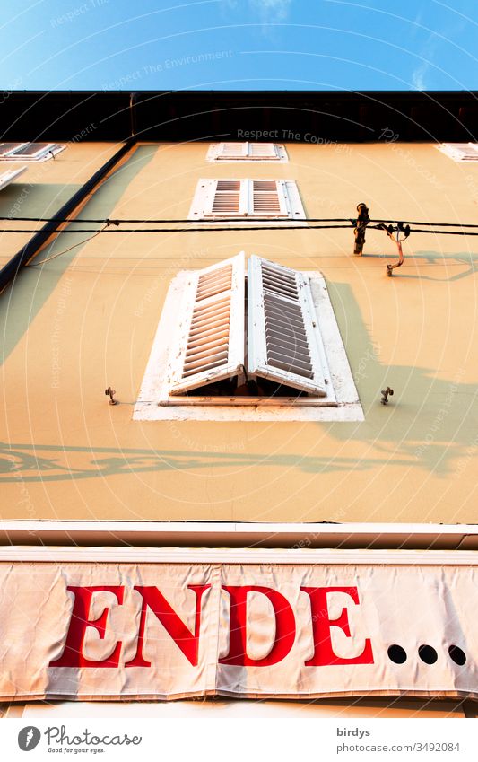 End, banner with the inscription "End" on a house wall. End of home quarantine, end of conditions. Universal Quarantine Termination covid-19 pandemic