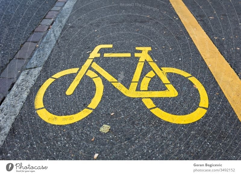 Yellow bicycle sign path on the road yellow drive symbol street urban way lane bike pathway information marking biking asphalt transport city ground town line