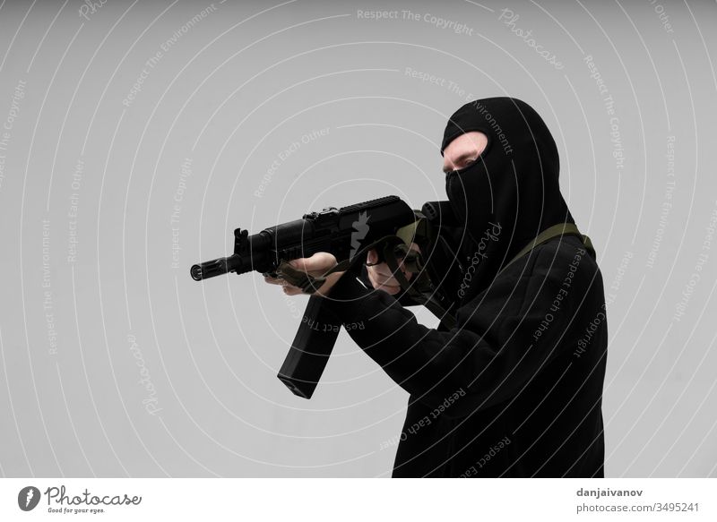 Man in mask With gun on white background aggression armed balaclava black crime criminal danger evil hand holding isolated killer male men murder people person