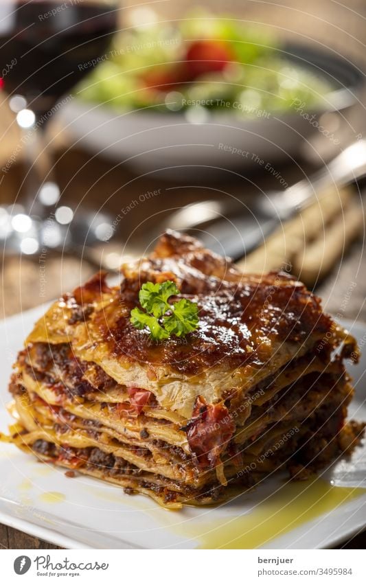 Lasagne on a plate Plate Delicious Minced meat dressed Carbohydrate pasta bake pile Italy European Bolognaise Rustic Tasty ingredient stratified bechamel