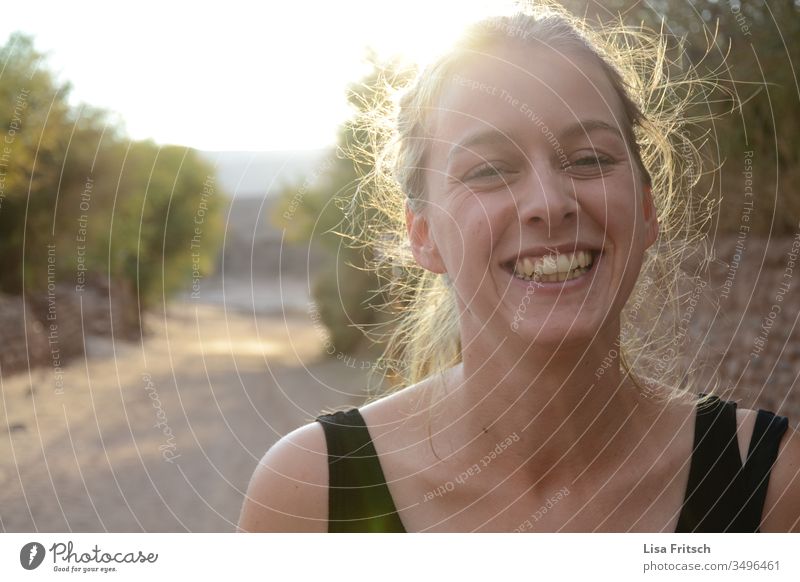 LAUGHTER - YOUNG WOMAN - SUNSHINE Laughter Sunlight Summer Vacation mood Tourism Joy Light heartedness Ease Good mood Lanes & trails Blonde vacation Optimism