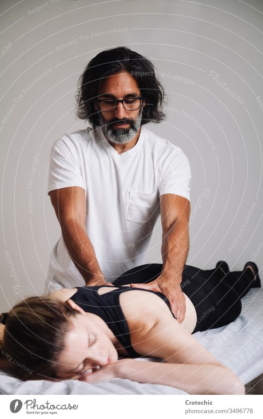 Reiki session alternative therapies. back correction therapy balance balancing chakras care energy hands heal healer healing healthcare holistic lying massaging