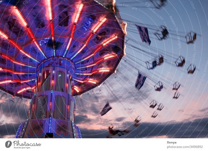 Carousel at night carousel Movement Joy Fairs & Carnivals Theme-park rides Flying Rotate Blue red lights Wave flight chain carousel Spirited Oktoberfest