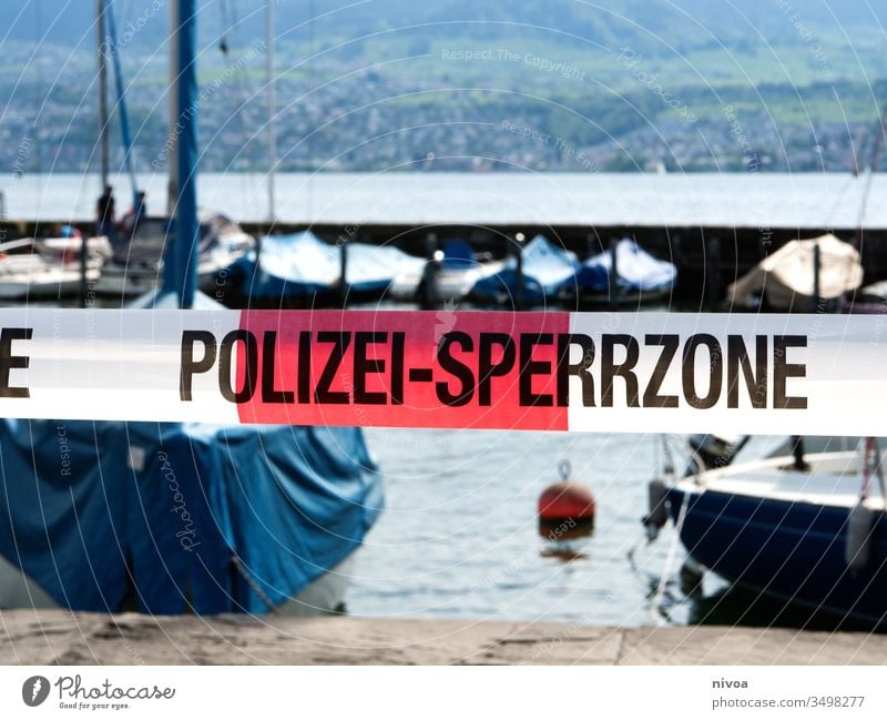 Corona Polizei Absperrung police Sign Exterior shot Safety coronavirus Surveillance Police Force Protection Lakeside Lake zurich Day Observe Colour photo