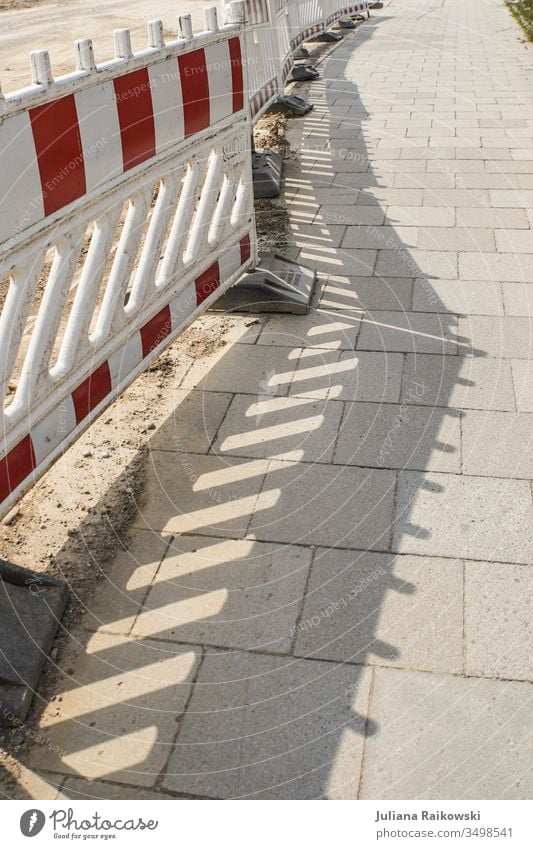 Shadow on the sidewalk from a site fence cordon Safety Protection Barrier Fence Construction site Structures and shapes Bans Exterior shot Hoarding Line