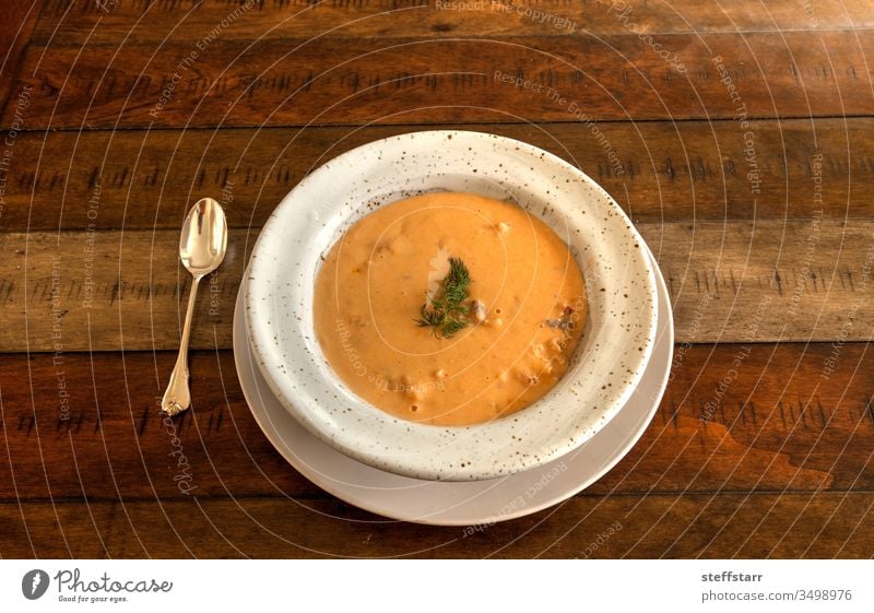 Fresh Seafood meal of Lobster bisque soup in a bowl lobster bisque lobster soup seafood fresh comfort food lunch dinner hot soup New England Lobster Bisque
