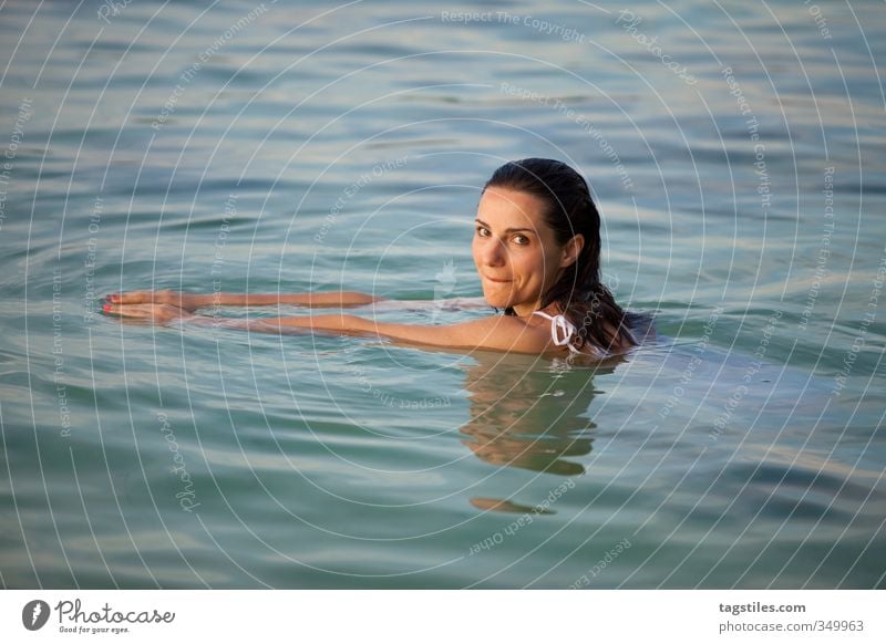 . Woman Swimming & Bathing Float in the water Mauritius Brunette Black Young woman Attractive Beautiful Sweet Cute Smooth Soft Ocean Vacation & Travel