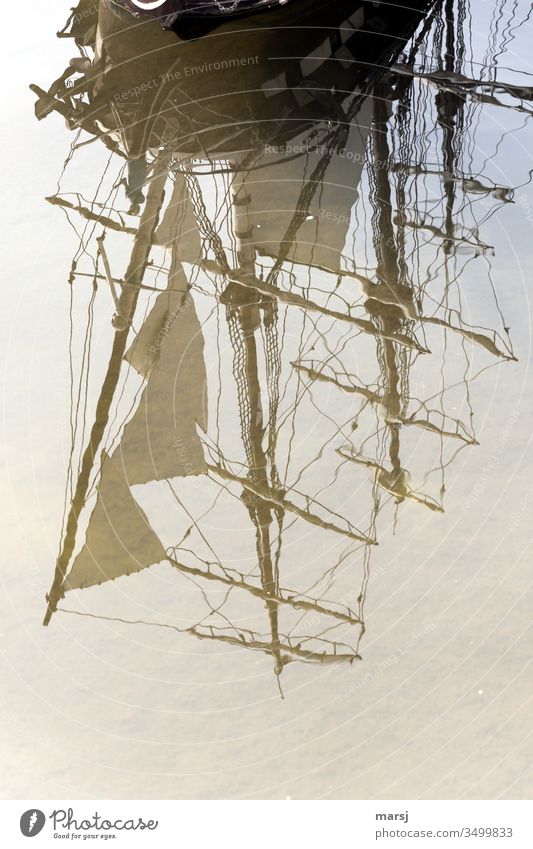 Antique sailing ship, which is reflected on the water surface Sailing ship Nostalgia Old Ancient Pole Reflection Reflection in the water Smooth Hazy Watercraft
