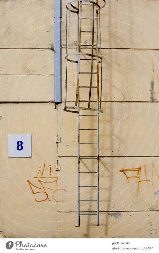 No. 8 next to ladder with shadow play Architecture Shadow play Ladder Wall (building) Metal Lanes & trails Silhouette Facade Hall Industrial Photography