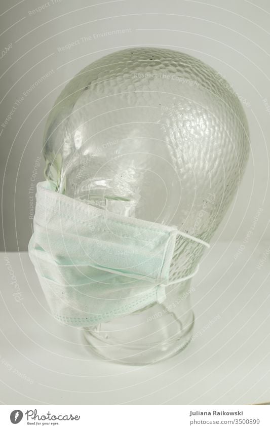 Glass head with breathing mask Respirator mask Virus Mask Illness coronavirus Healthy flu Protection Epidemic Risk of infection Infection Corona virus pandemic