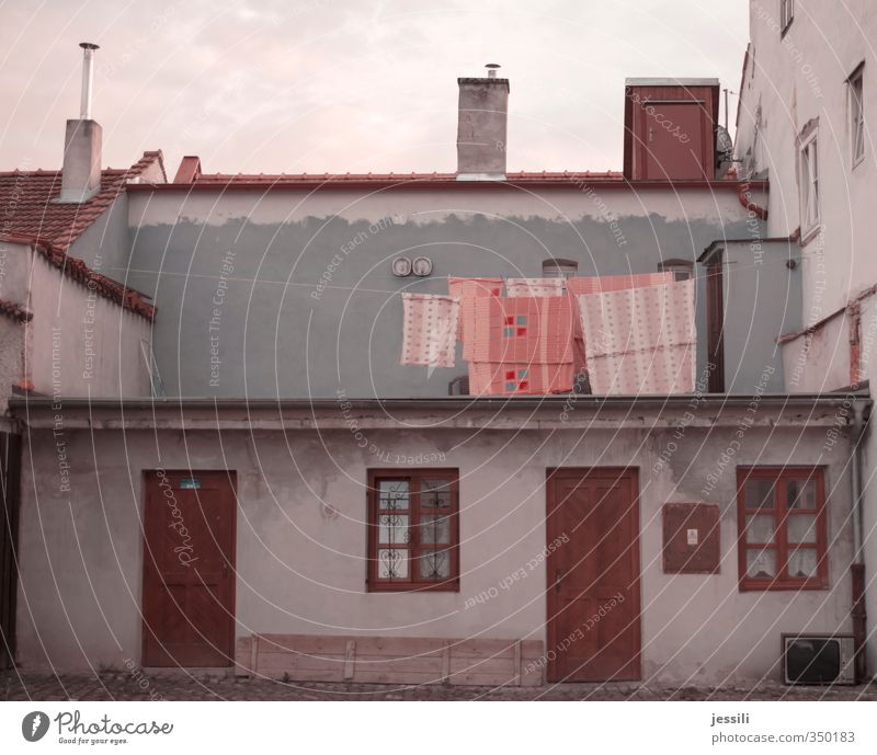 laundry Summer Blue Orange Orderliness Clothesline Laundry Bedclothes dry floor Washing day Household Roof terrace Colour photo Exterior shot Deserted Evening