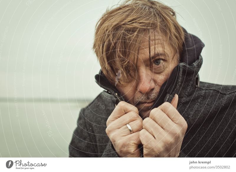 Hushi Strand of hair Man portrait Human being Looking Cold Freeze Frost Winter Lake Body of water Audacious Exterior shot Coat Looking into the camera