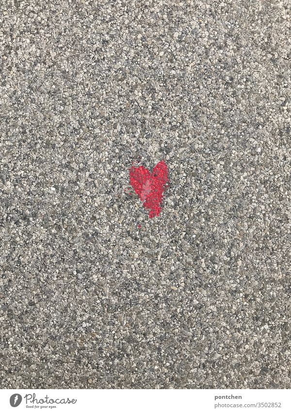 Small red heart painted on grey asphalt Heart Love symbolism Mother's Day Red Asphalt off Street Colour Painted creatively Exterior shot Valentine's Day