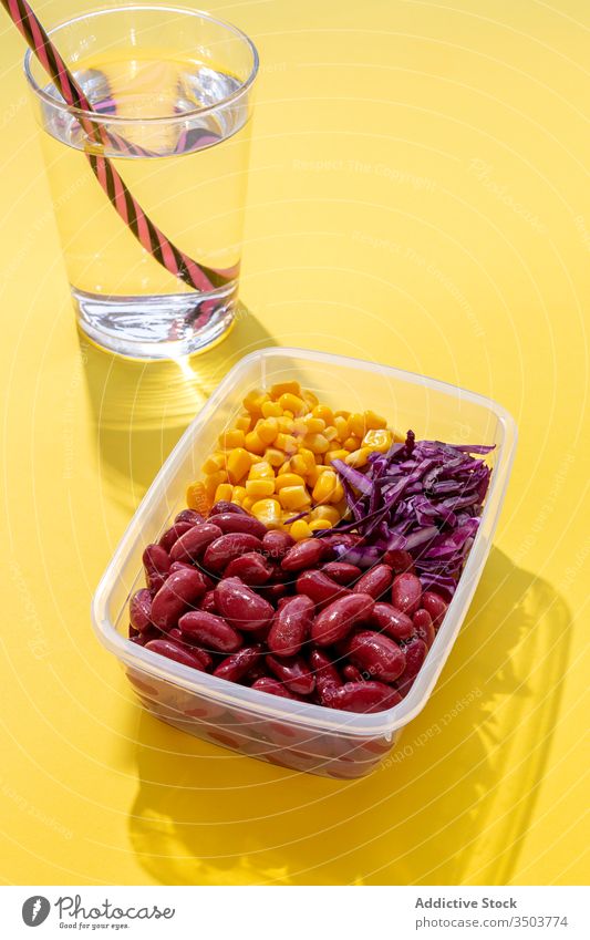 Homemade vegan food in lunch boxes with fresh healthy vegetables plastic healthy food Plastic containers to take away from above flat lay top view corn