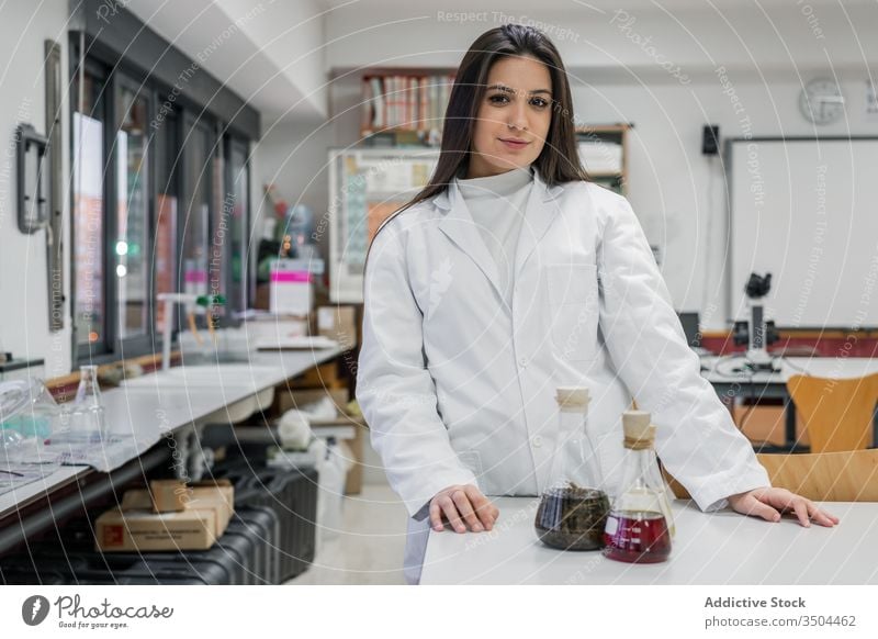 Young scientist in contemporary lab woman laboratory chemistry student university young experiment research smart female study learn education table modern