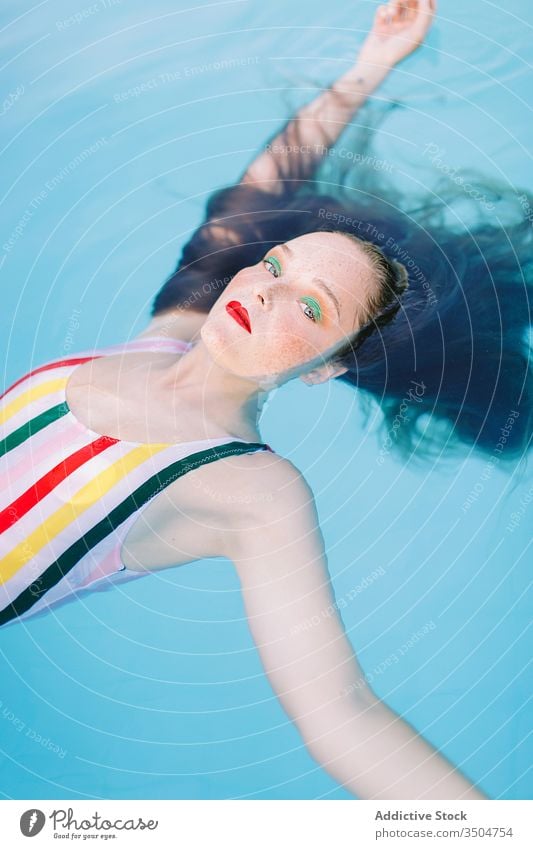Teen Girl Having Fun In The Swimming Pool summer water portrait girl happy person swimming pool vacation young leisure teenager fun female beautiful lifestyle