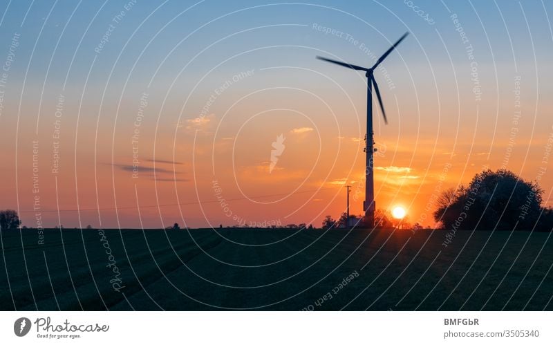 silhouette pinwheel at sunrise agriculture alternative change clean climate change construction development earth ecological ecology electric electrical