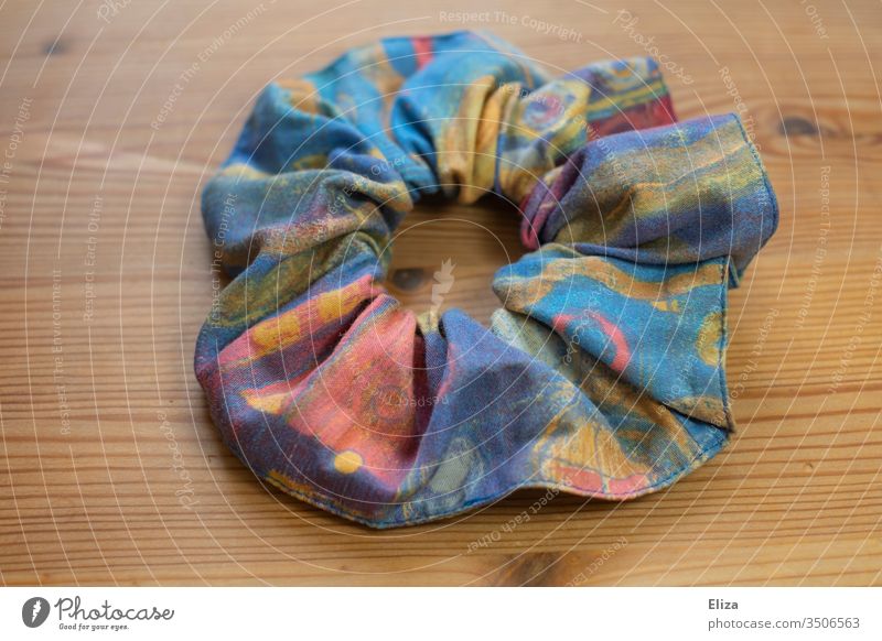 Colorful plait rubber scrunchie in retro-color Scrunchie braid rubber Hair and hairstyles Elastic hairband Interior shot variegated Cloth Colour photo