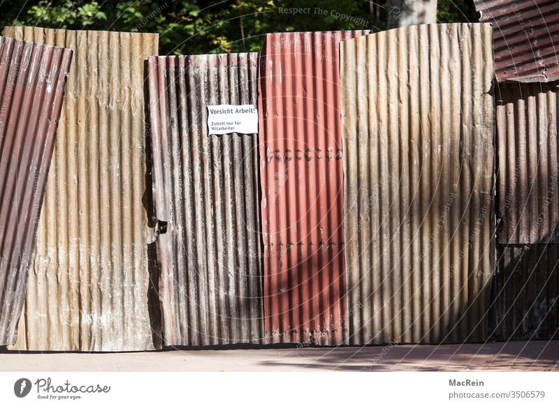 Prohibited zone Corrugated sheet iron Corrugated iron wall Clue Signage Access Admission dilapidated Bruised Warped slanting nobody Copy Space Exterior shot