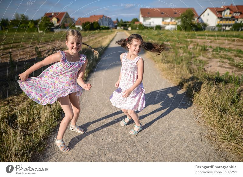 Two sisters play games buzzer Sun jumpin Dance Smiley happy Shadow Field Village girls Dress