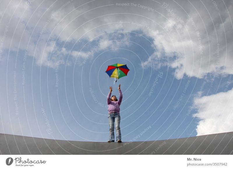 umbrella Umbrella Throw Catch variegated Prismatic colors Sky Clouds Playing Leisure and hobbies Movement Freedom Self-confident Cool (slang) Gale Wind