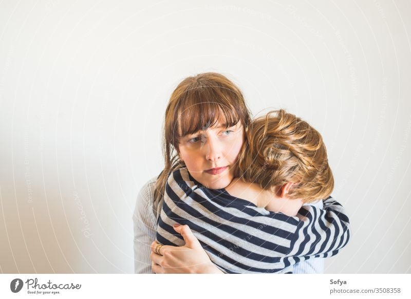 Young mother and child hugging. Mothers day mom parent mothers day protective angry support comfort cheer up frustrated trouble upset woman lifestyle kid love