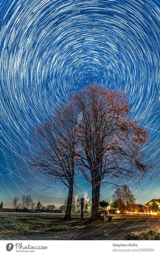 Circular starry sky due to the long time exposure of the night with focusing on the polar star Polaris. startrails stars Polar star Night Sky Exterior shot