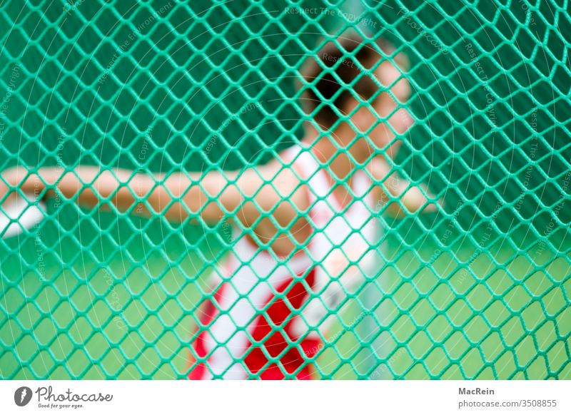 Discus thrower behind a safety net Discus disc Athlete Sportsperson Net Trajectory Effort litter Slice target stop Competition Athletes Track and Field