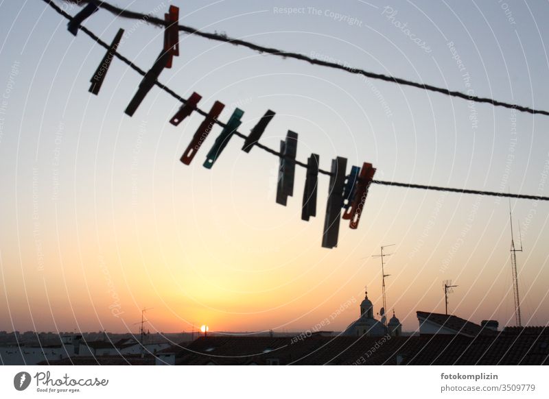 Clothesline with staples in the setting sunset over the roofs of Madrid ;) Clothes peg hang Roof terrace City life Hang up Household Living or residing Skyline