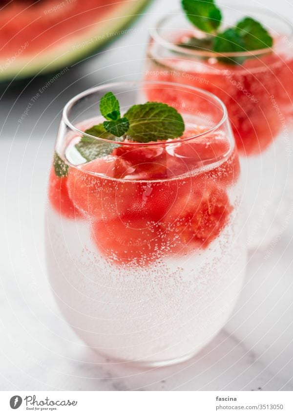 Watermelon ice with sparkling water in glasses ball watermelon fruit beverage summer dessert fresh cold red cool gourmet background sweet juice frozen juicy bar