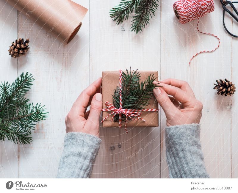 Woman packing presents for Christmas in boxes female hands vintage table holiday christmas woman hygge people wrapped december decor copyspace merry packaging