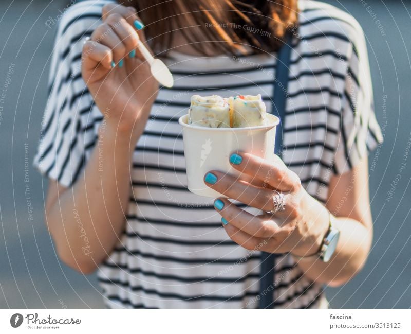 Hand holding rolled ice cream in cone cup icecream iced hand woman baked fruit fry copy space background ice-cream summer dairy delicious dessert food freshness