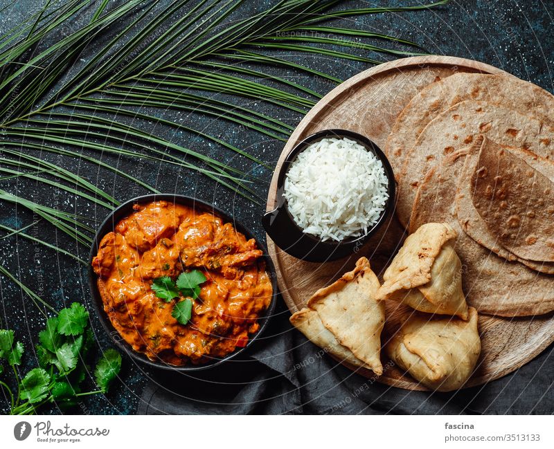 Indian food and indian cuisine dishes, copy space meal overhead curry spicy chili lamb meat hot background samosa bread chicken tikka rice naan banquet top view