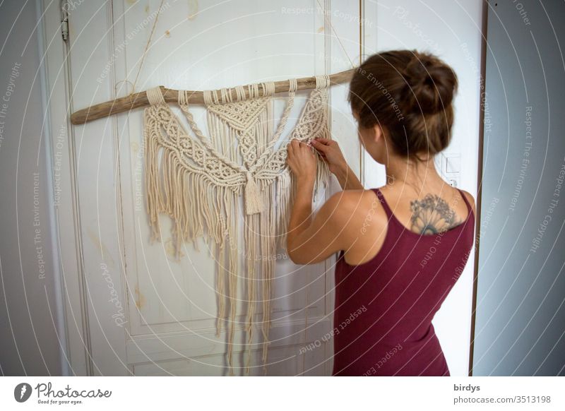 Young woman creatively engaged in macramé work at home stay home Macramé Creativity Handcrafts active stay at home Employment ideas Productive Knot knot
