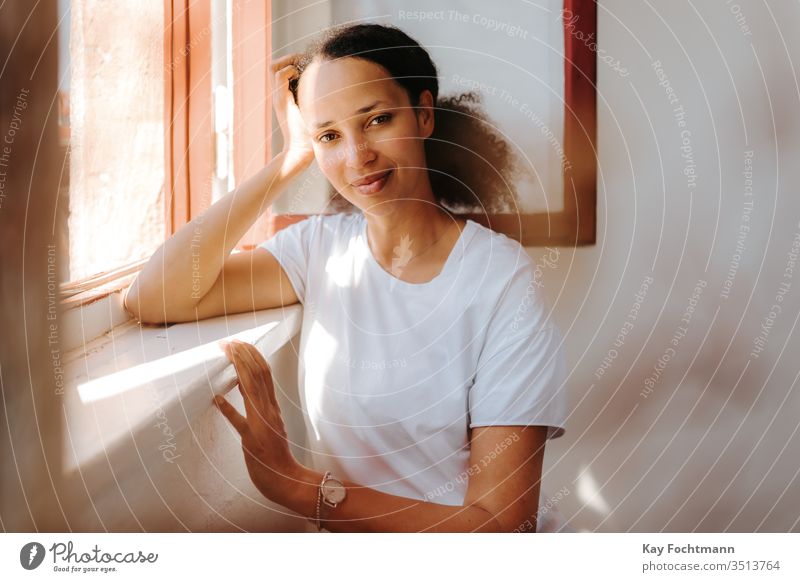 Dreamy Black Woman Leaning On Window A Royalty Free Stock Photo From Photocase