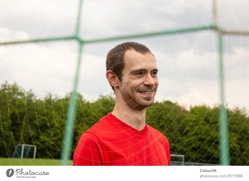 Portrait from Sportsman portrait head soccer player sport football goal sportsman champions grass game competition winner net smile smiling sporting person