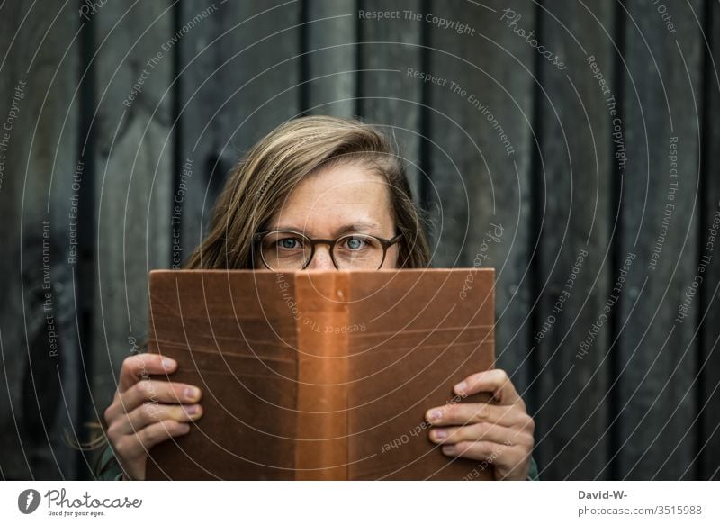 person young woman with glasses reading a book Woman Reading Book Nostalgia nostalgically Eyeglasses Tension Novel Person wearing glasses Young woman Student