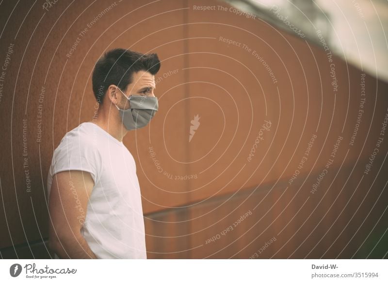 Man with breathing mask Respirator mask coronavirus Virus Self-made Mask Illness Healthy pandemic Protection Contagious Epidemic Sick Quarantine COVID Infection