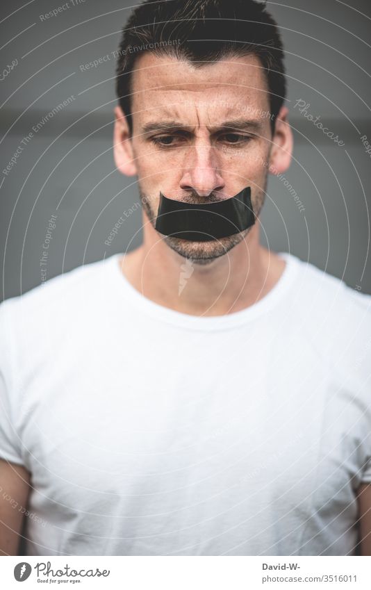 Prohibition to speak - man mouth glued shut Muzzle Mouth pasted up gag Adhesive tape Silent Fall silent Bans Calm Fear Freedom of expression free