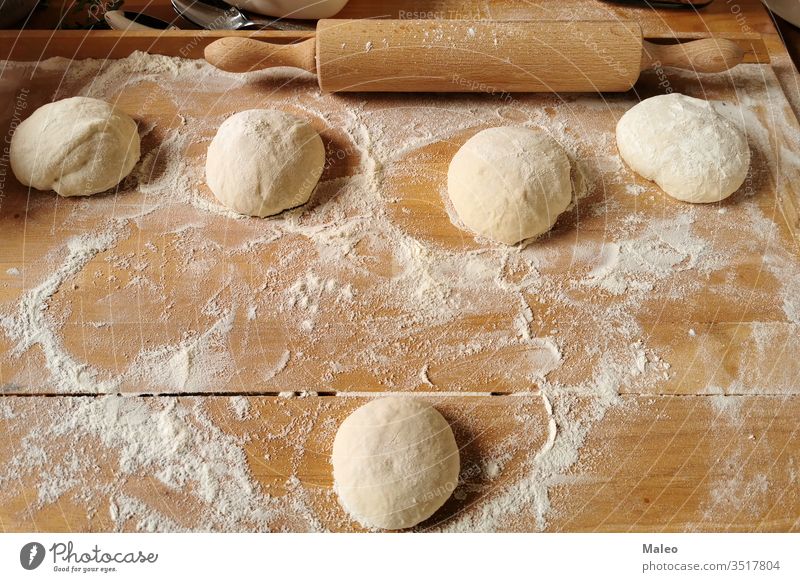 Pizza. The process of making pizza dough cooking food preparation table cuisine baking raw ingredients italian italy parsley round flour working mushrooms sauce