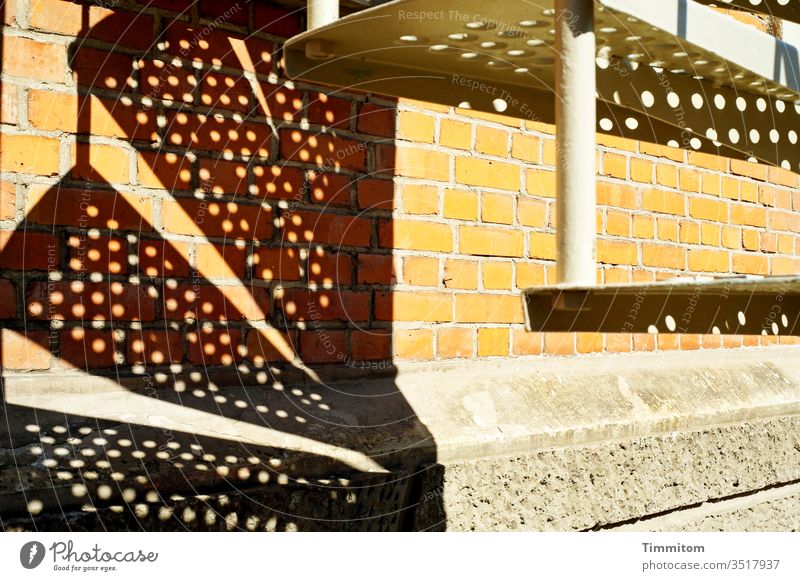 Stairs-steps-shadows (2) stair treads Metal Plate with holes Shadow Building Wall (building) bricks Foundations Flashy Deserted Colour photo light and dark